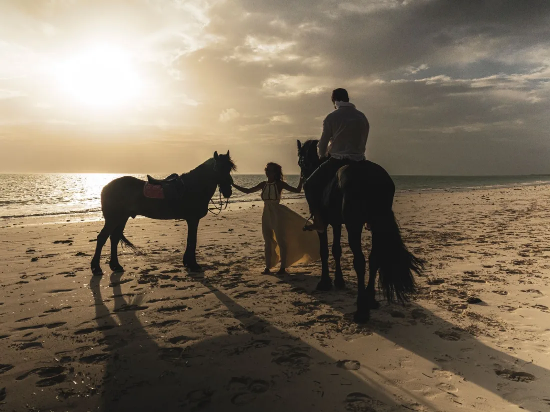 Horse riding through the Paje lagoon at sunset
